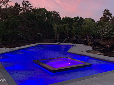 Lazy-L-gunite-pool-built-with-a-raised-spa-in-sundeck-Souththampto Lazy-L-gunite-pool-built-with-a-raised-spa-in-sundeck-Souththampto