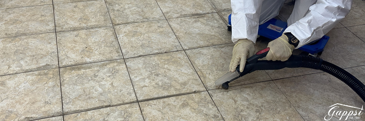 2-Tile-and-grout-cleaning-steam-washing-and-brusching-grout-joints