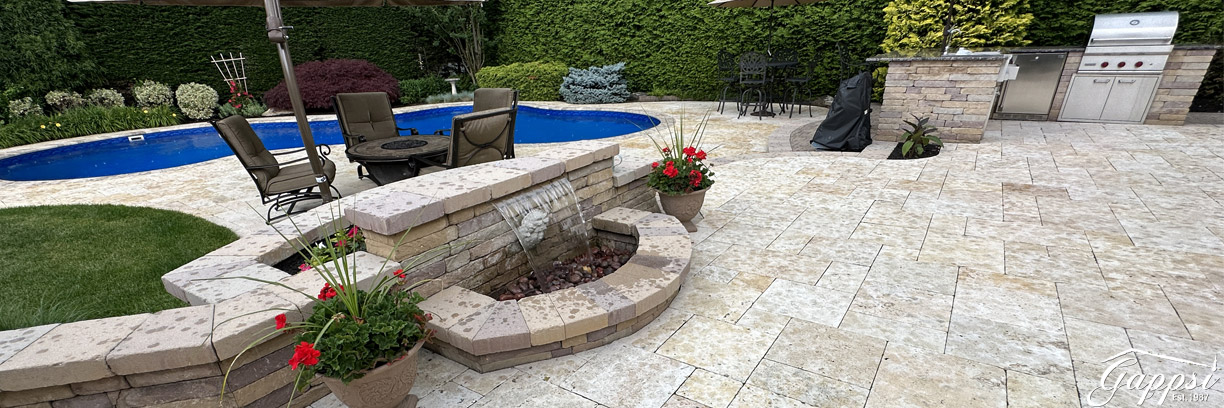Free-Formed-Vinyl-Pool-and-Travertine-Patio-Installation-in-Smithtown