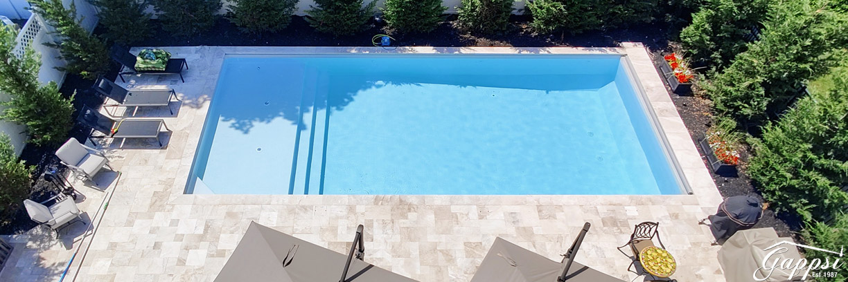 Swimming-Pool-with-Marble-Pavers,-Sundeck-and-Water-Bubblers--Bellmore-NY