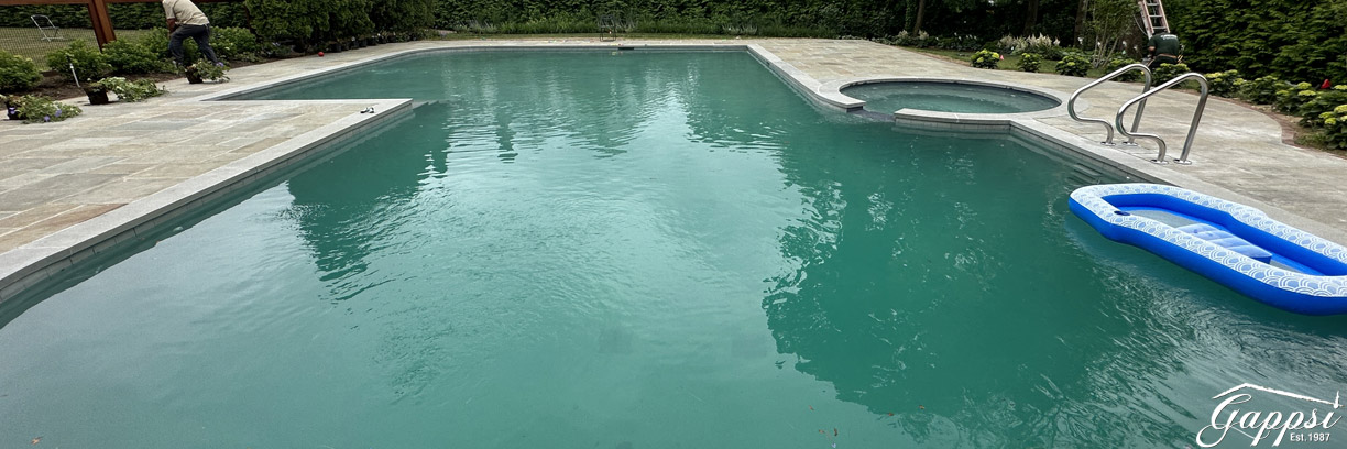 marble-dusting-gunite-swimming-pool-on-long-island-in-cedarhurst-ny