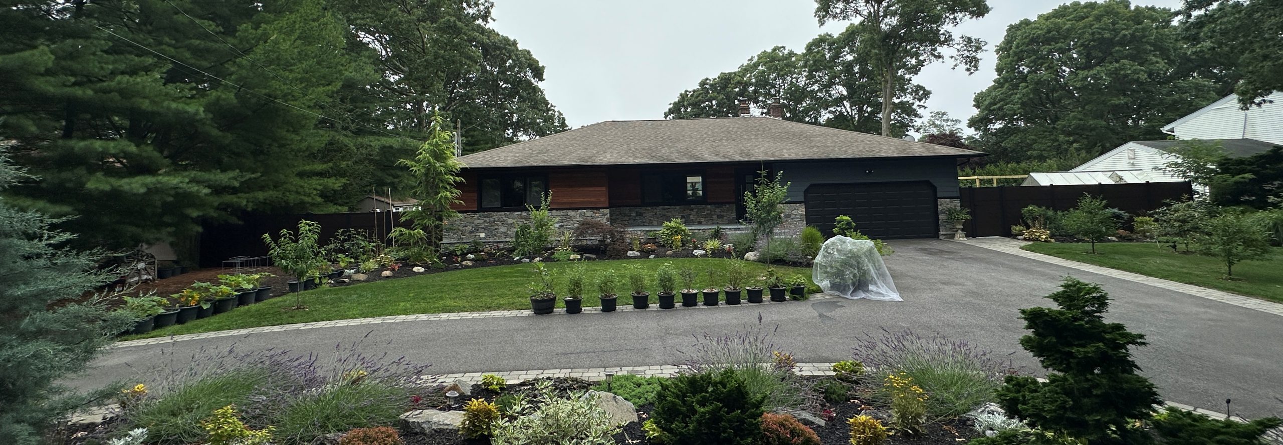Home remodel with greenwood fence