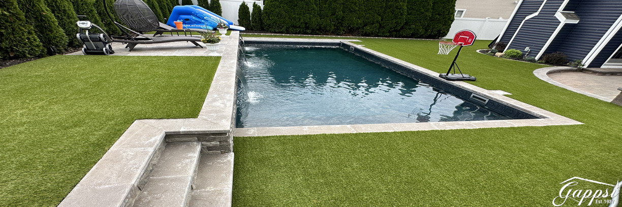 maintenance-free-backyard-with-synthetic-grass-and-vinyl-pool