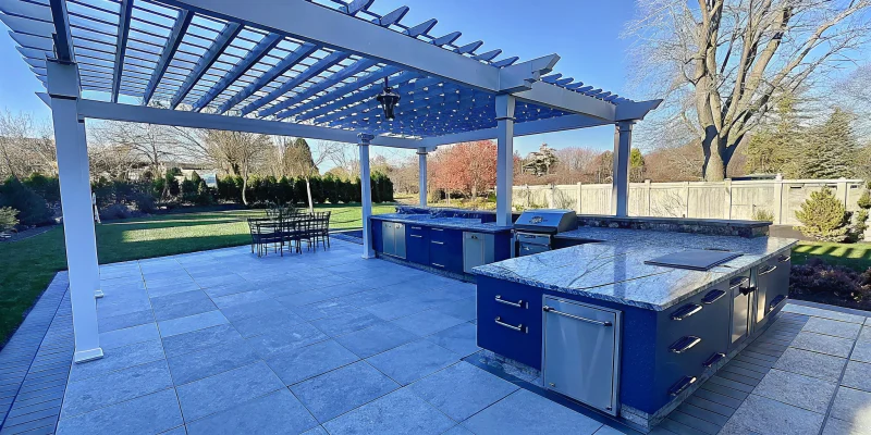 Danver stainless steel outdoor kitchen with custom cabinets and a built-in grill.
