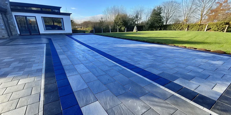 Getting a quote for a new paver driveway with a modern design.