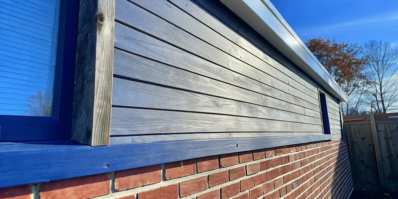 A wood frame wall with a brick veneer exterior.