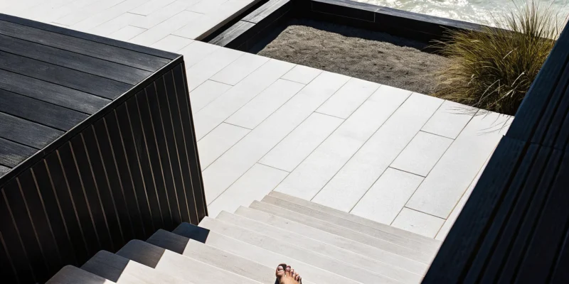 A modern patio with large porcelain pavers from the largest suppliers on Long Island, NY.