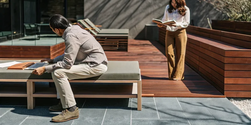 Outdoor living contractor and designer planning a new patio with a homeowner in Long Island, NY.