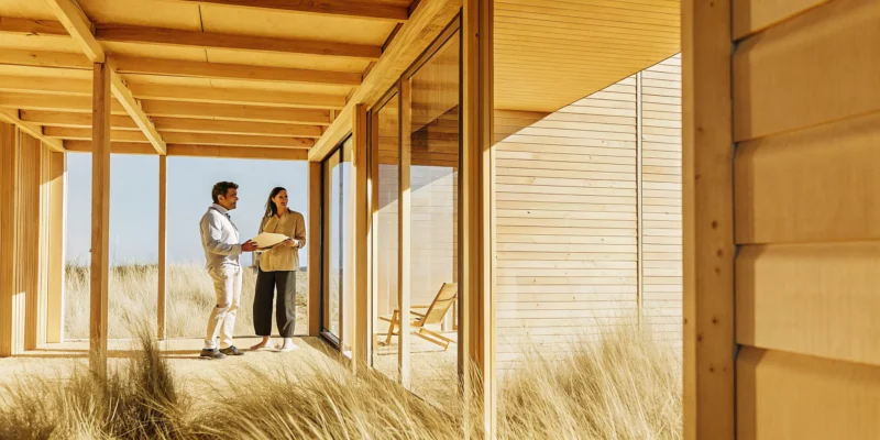 A padel court builder discusses construction plans with a client in Long Island, NY.