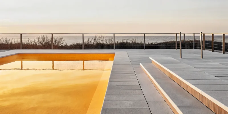 A modern inground swimming pool built by one of Long Island, NY's best pool companies.