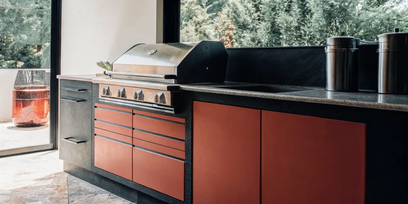 Modern outdoor kitchen with Summit outdoor refrigeration and appliances from a Long Island, NY dealer.