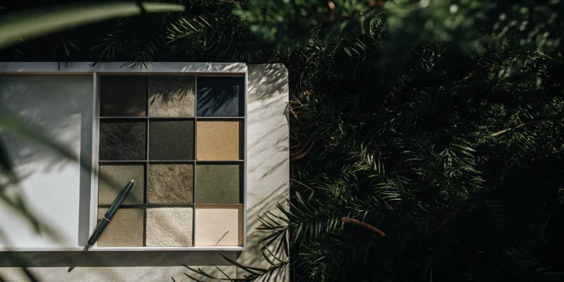 Calculating the average cost of a natural stone patio installation with various stone samples.