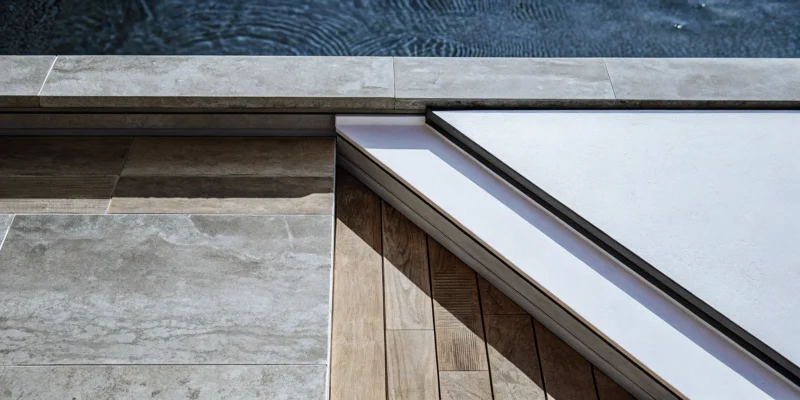 The best porcelain pavers and copings for a modern pool patio on Long Island, NY.