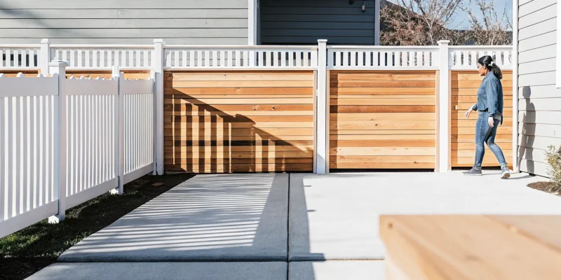 A modern, low-maintenance Greenwood privacy fence in a homeowner's backyard.
