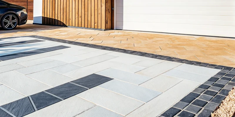The best porcelain pavers for a driveway installed in a modern, two-tone design.