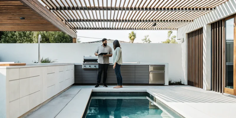 Custom outdoor kitchen with a pergola built by a professional construction company.