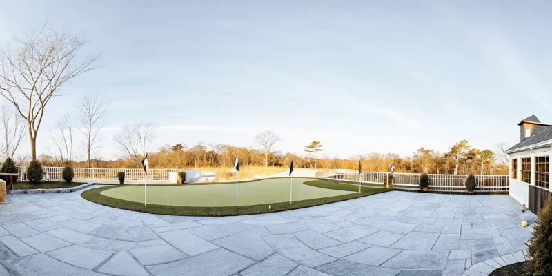 Custom backyard putting green at a Long Island home