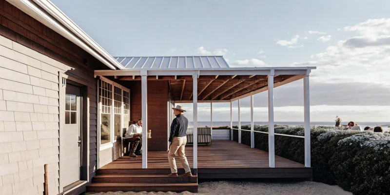 A Long Island pergola builder constructed this modern wood pergola on a backyard deck.