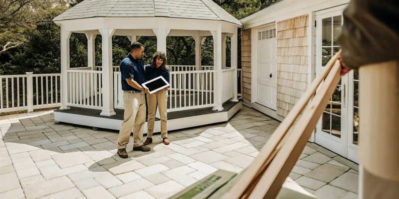 Gazebo installer on Long Island planning a new installation with a homeowner.