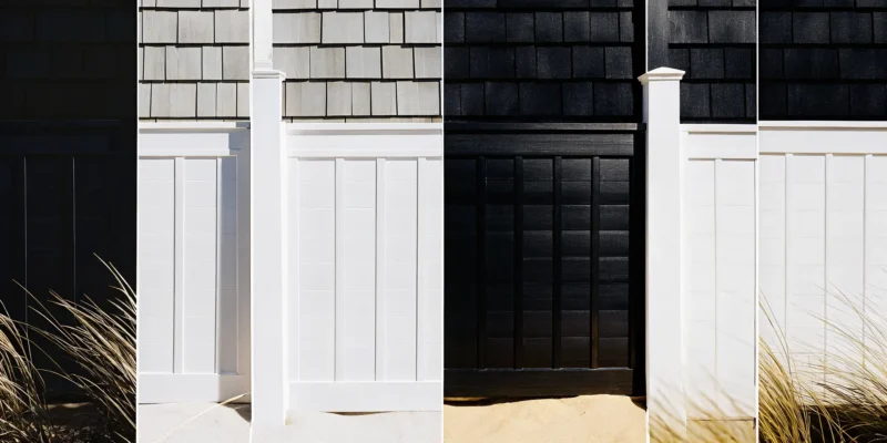 Custom fence design in Long Island featuring modern black and white panels.