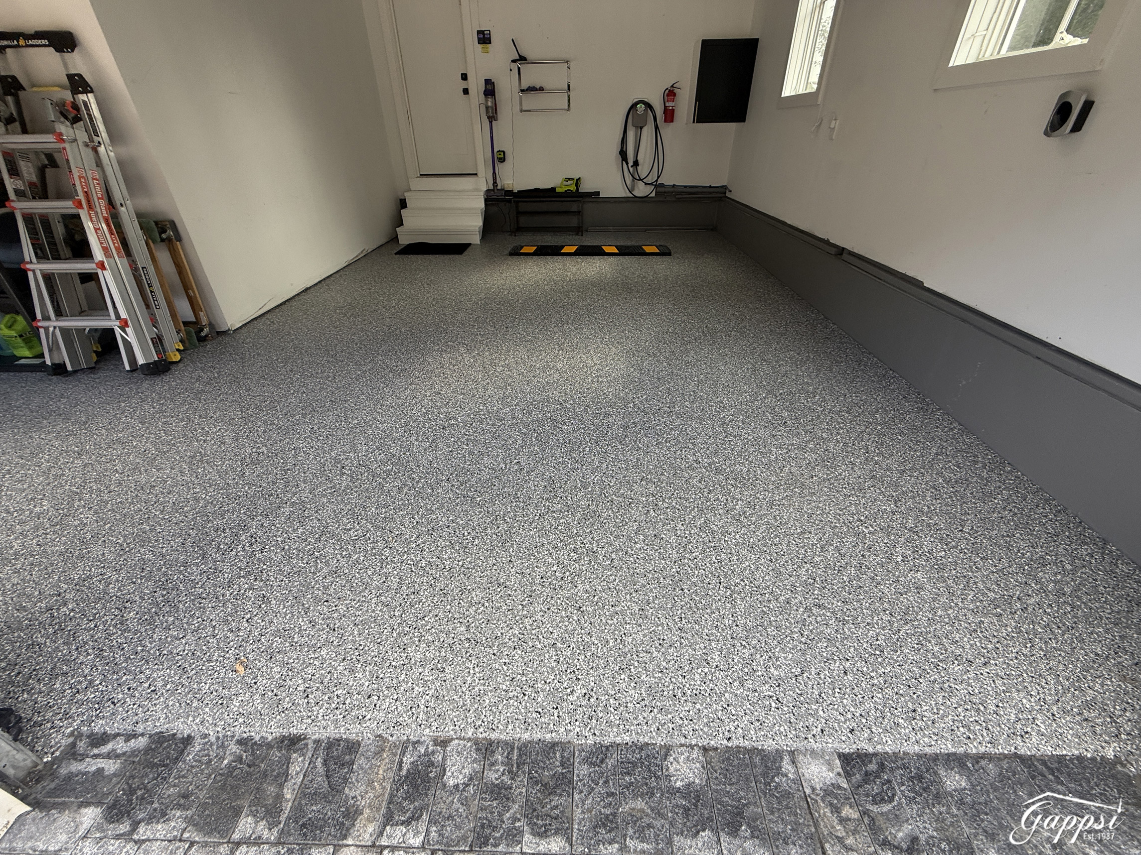 belgian-stone-paver-apron-and-epoxy-garage-flooring-in-bridgehampton