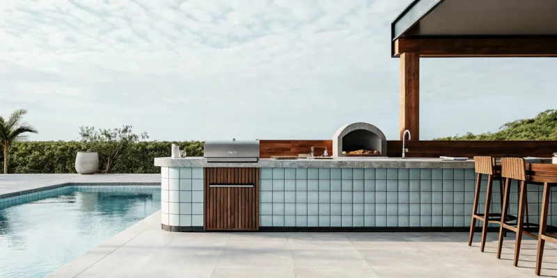 A Long Island company offers 3D design for a modern outdoor kitchen with a grill and pool.